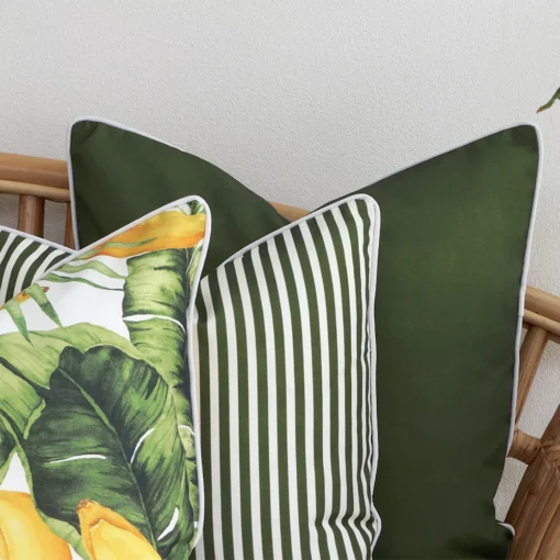 A zoom in view of this set of 3 olive outdoor cushion covers.
