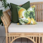 Olive outdoor couch cushions, snugly nestled within the lush greenery of the outdoors.