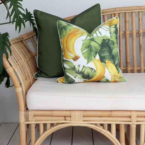 Olive outdoor couch cushions, snugly nestled within the lush greenery of the outdoors.