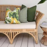 A banana designed outdoor couch cushion is paired perfectly with solid and striped olive cushions.