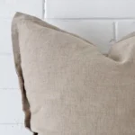 Macro image of a linen large cushion cover. The shot shows the stone hue more thoroughly.