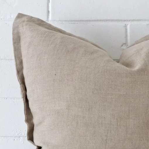 Macro image of a linen large cushion cover. The shot shows the stone hue more thoroughly.