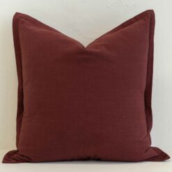 Burgundy linen cushion with deep red tone and subtle textured weave.