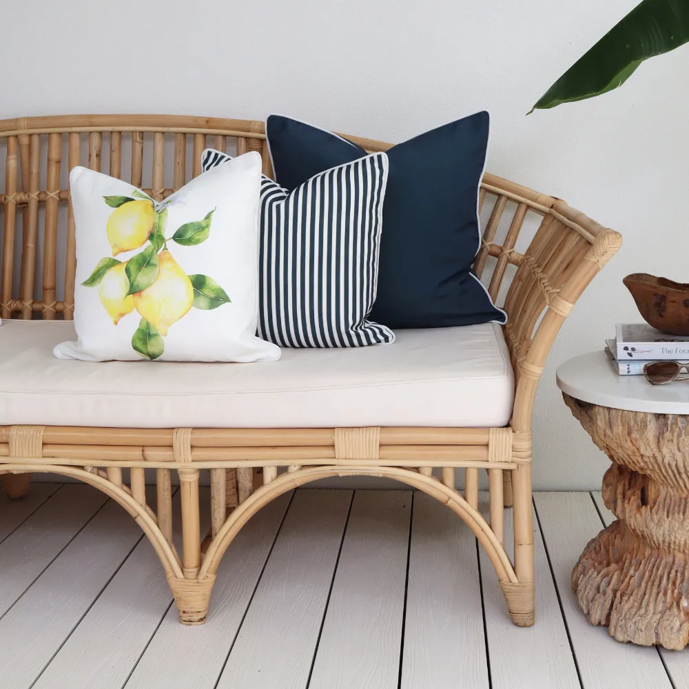 An outdoor cushion set on a chair outside.