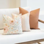 The Claybourne set is arranged in the corner of a white sofa.