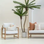 White living room with a set of 4 Claybourne oudoor cushions on a wooden sofa.