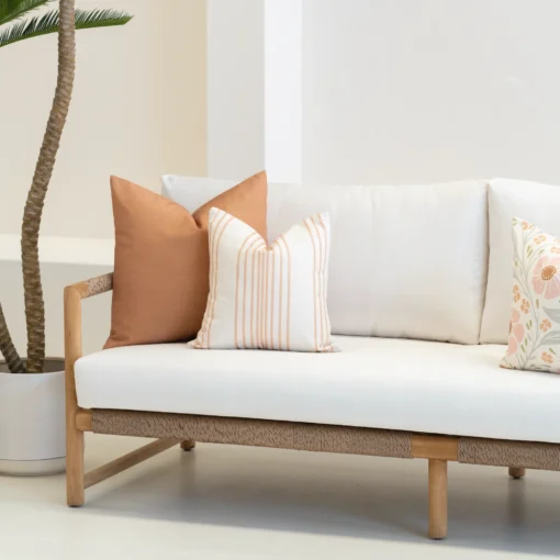 Outdoor living area showcasing 3 outdoor cushions from the Claybourne set.