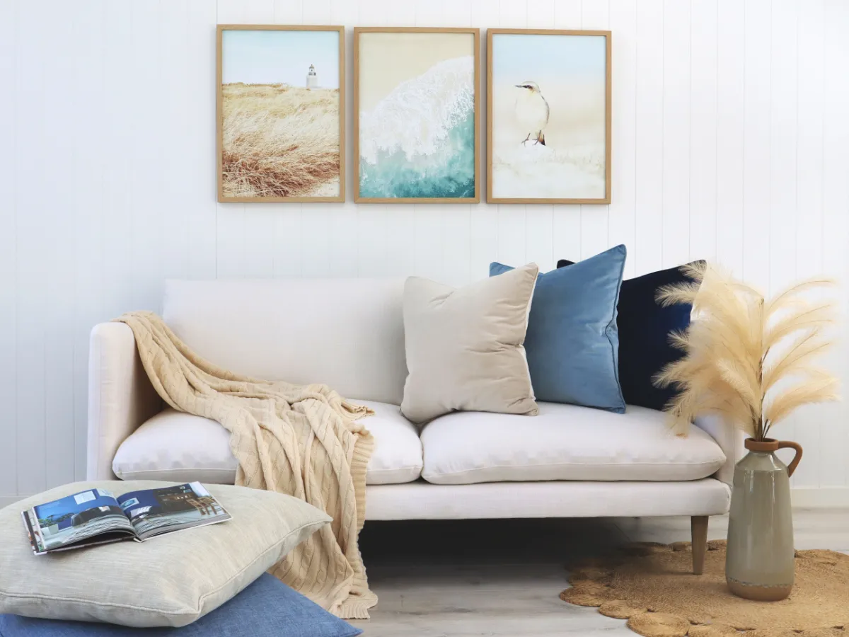 A coastal style living room with soft sand blues and navies inspired by the ocean.
