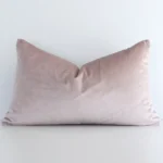 A gorgeous velvet rectangle cushion in dusty pink. It has an eye-catching solid colour design.