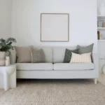 A beautiful combination of 5 couch cushions positioned on light grey sofa.