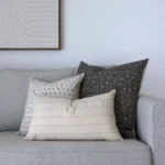 3 designer couch cushions from the Essa set look elegant in a corner of a sofa.