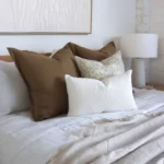 4 bed cushions from the Eve set complement the white bedroom perfectly.