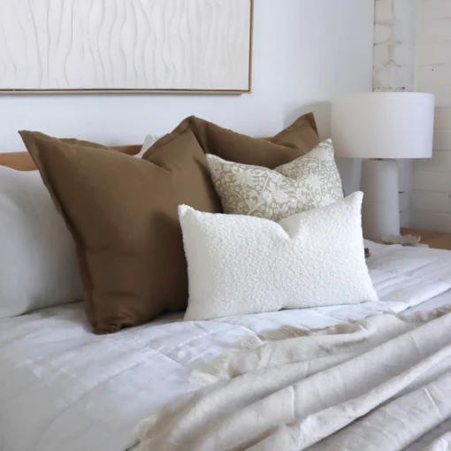 4 bed cushions from the Eve set complement the white bedroom perfectly.