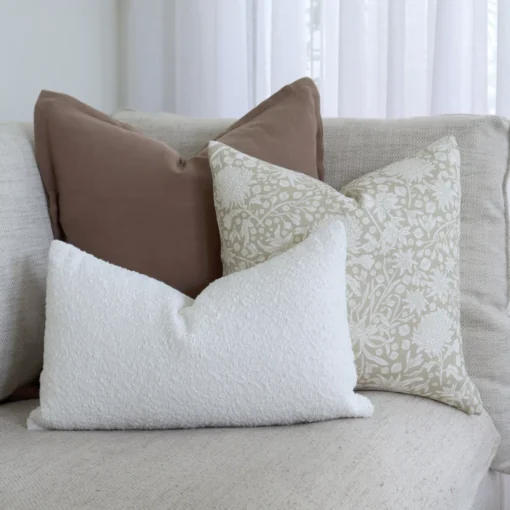A set of 3 Eve couch cushions sit is displayed in the corner of a sofa.