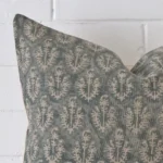 A very close image of the corner of a designer cushion. It has a large size.
