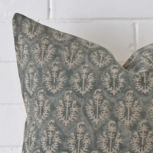 A very close image of the corner of a designer cushion. It has a large size.