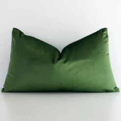 A premium rectangle forest green cushion boasting a solid green design and in a rectangle size.
