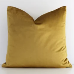 Gorgeous square velvet cushion cover that has a gold mustard hue. It has a graceful solid-coloured design.