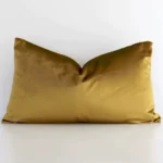 Front view of solid-coloured rectangular cushion. Crafted from a special velvet material in a gold mustard colour.