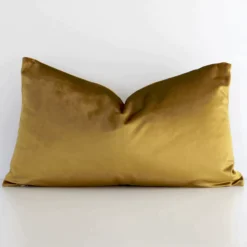 Front view of solid-coloured rectangular cushion. Crafted from a special velvet material in a gold mustard colour.