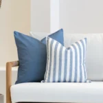 A white sofa with the horizon blue set displayed on its corner.