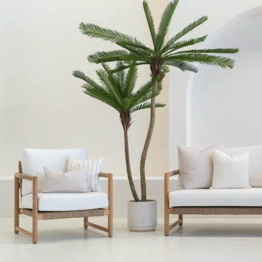 Outdoor seating with a set of 4 horizon sand outdoor cushions on it.