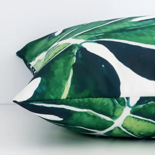 A side view of outdoor tropical cushion that has a square shape.