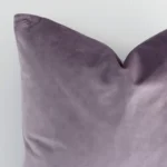Precision shot of this square lavender cushion cover. It is possible to see the solid colour style and velvet fabric in greater depth.