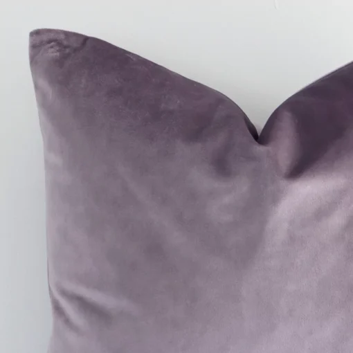 Precision shot of this square lavender cushion cover. It is possible to see the solid colour style and velvet fabric in greater depth.