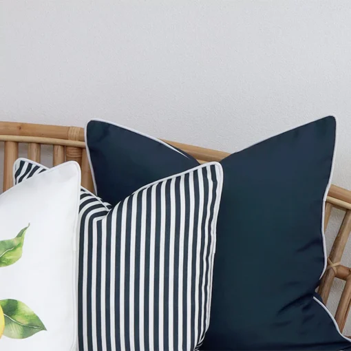 The details are magnified in this close-up view of 3 navy outdoor couch cushions.