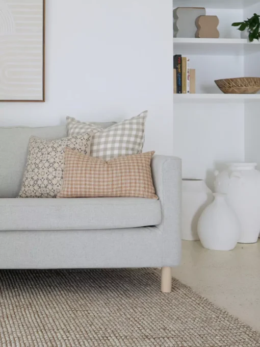 The Lennox sofa cushions set's five meticulously chosen designer cushions embellish the grey sofa with style and sophistication.
