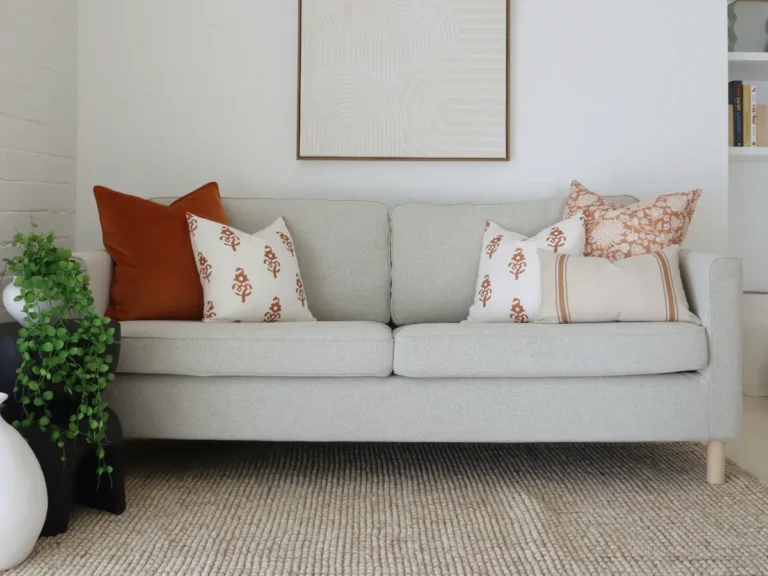 A lounge room styled showing how many cushions fit on it.