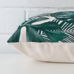 A side shot of a linen cushion cover. The angle shows the edge of the square shape.