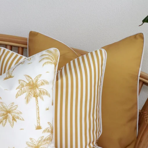 A close-up image of 3 mustard outdoor couch cushions provides a thorough view of the colour hue and style.