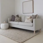 The sophisticated Nellie sofa set, a collection of 5 designer cushions looks charming on a grey sofa.