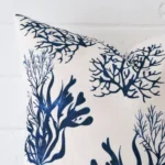 Zoomed photo of the top left corner of this patterned cushion cover. The image clearly shows the linen material and square dimensions.