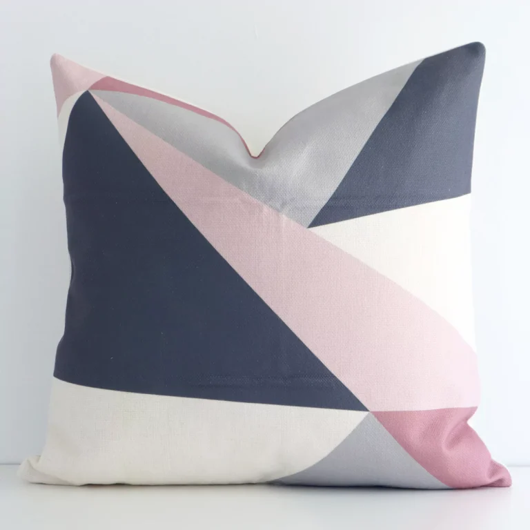 A graceful square colourful cushion with a geometric style on durable linen fabric.