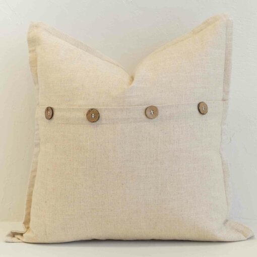oatmeal-linen-button-cushion-cover---sc1140-45 Oatmeal linen cushion with button closure detail and natural woven texture.