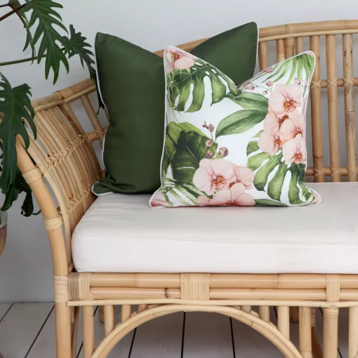 The elegance of olive outdoor cushions adorning a rattan sofa, offering both relaxation and sophistication.