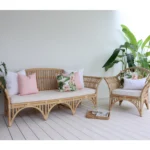 A perfect mix of pink outdoor cushions with floral prints adding charm to the lounge area.