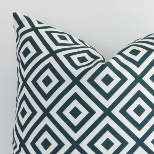 A zoomed view of this outdoor green cushion’s corner that shows a magnified view of its geometric design and its square size.
