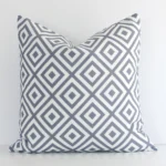An eye-catching outdoor square cushion cover featuring a hue that is grey. It has a unique geometric style.