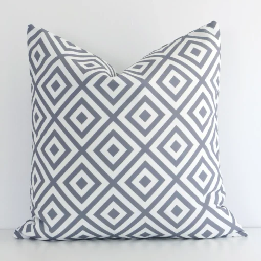 An eye-catching outdoor square cushion cover featuring a hue that is grey. It has a unique geometric style.