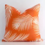 A superior outdoor orange cushion cover yielding a palm printed style and in a classy square size.