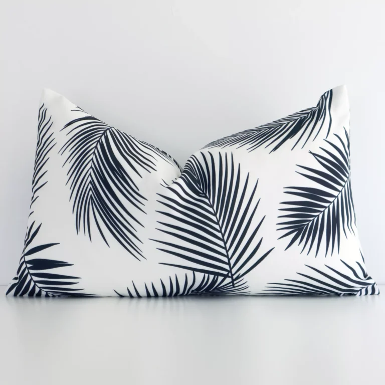 A stunning rectangle outdoor cushion in a black and white colour. It has an exquisite palm design.
