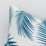 A zoomed view of this outdoor teal palm print on cushion’s corner that shows a magnified view.