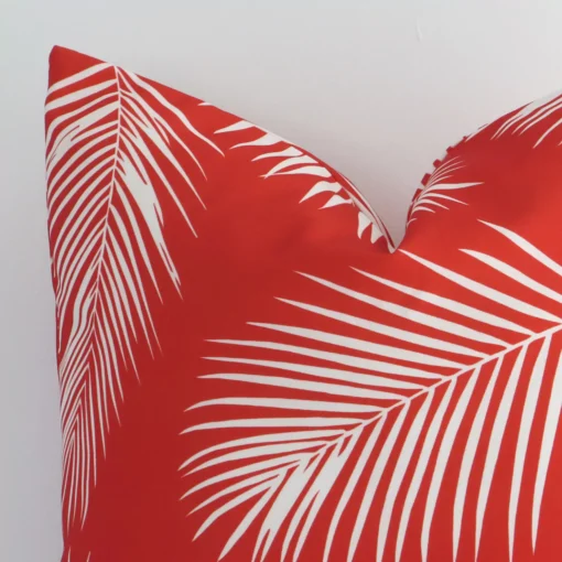 Close up of an outdoor square cushion. The quality of its palm design is shown in fine detail.