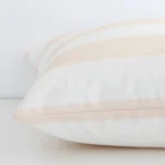 Beige striped cushion cover laid on its back side. The image shows a side-on view of the outdoor material and its large dimensions.