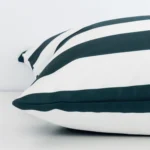 Green striped cushion cover laid on its back side. The image shows a side-on view of the outdoor material and its large dimensions.