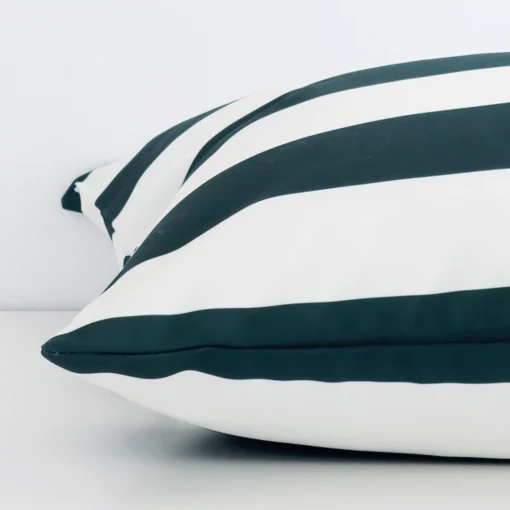 Green striped cushion cover laid on its back side. The image shows a side-on view of the outdoor material and its large dimensions.